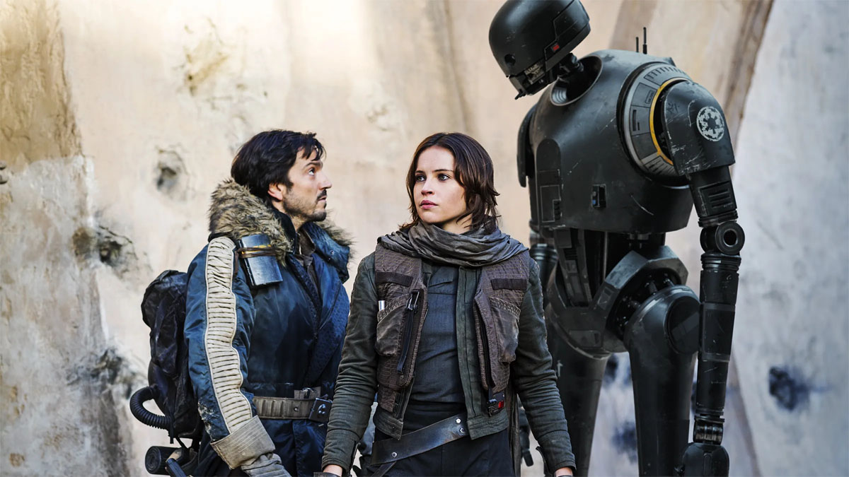 Diego Luna, Felicity Jones, and the droid K-2SO in a scene from Rogue One.