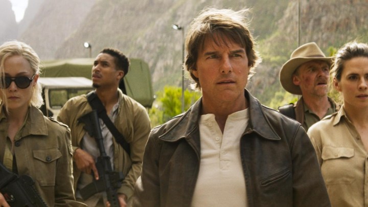 Tom Cruise and a group of people stand together in Mission: Impossible The Final Reckoning.